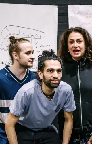 A group of young theatre trainees posing for photo